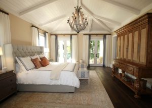 A new master bedroom room addition with vaulted ceilings and a chandelier