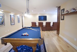 Game room with a pool table and television 